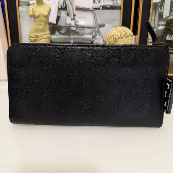 Gucci Handbags - Authentic Gucci Guccissima Zip Around long leather wallet Black with COA .